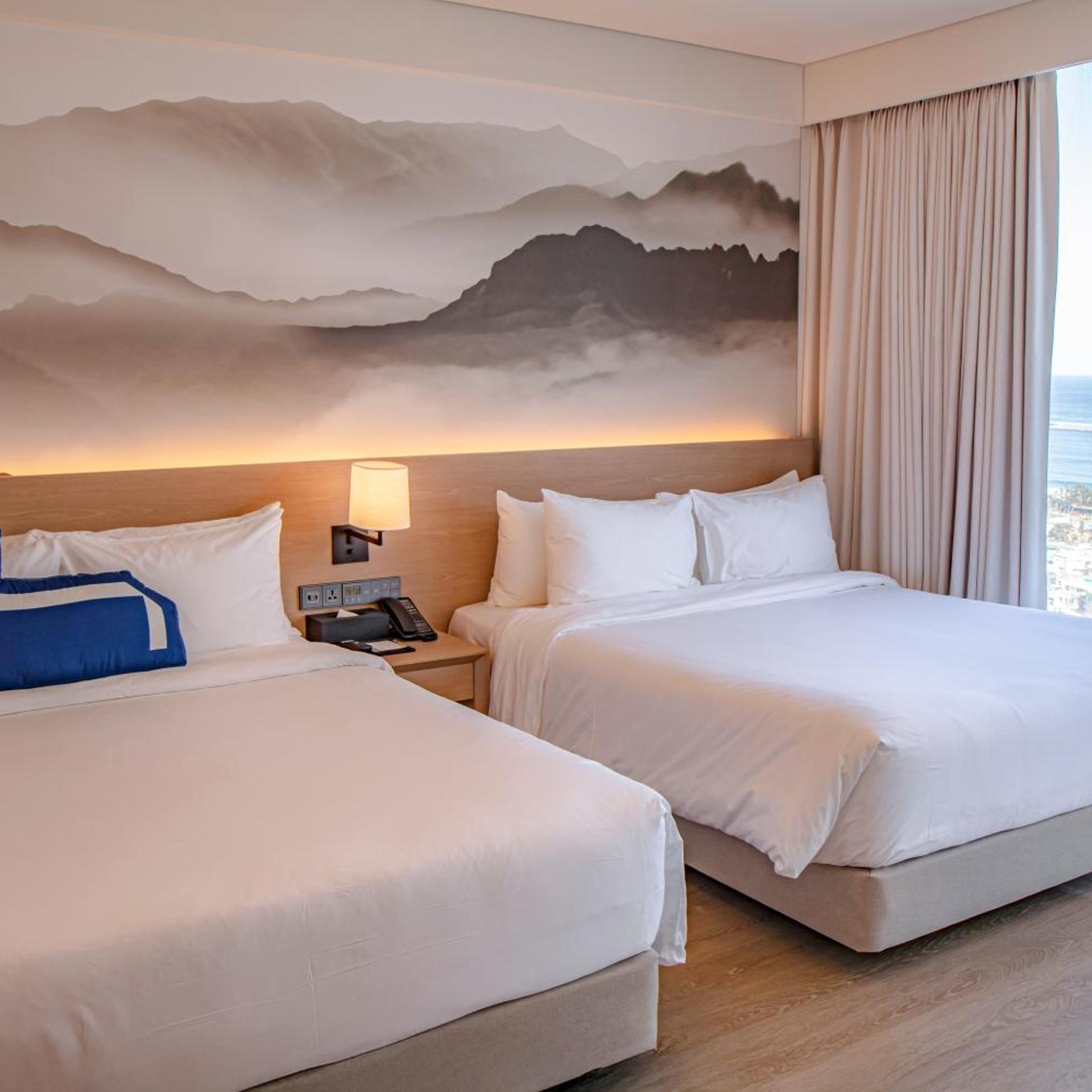 Junior Suite Two Queen Partial Ocean View