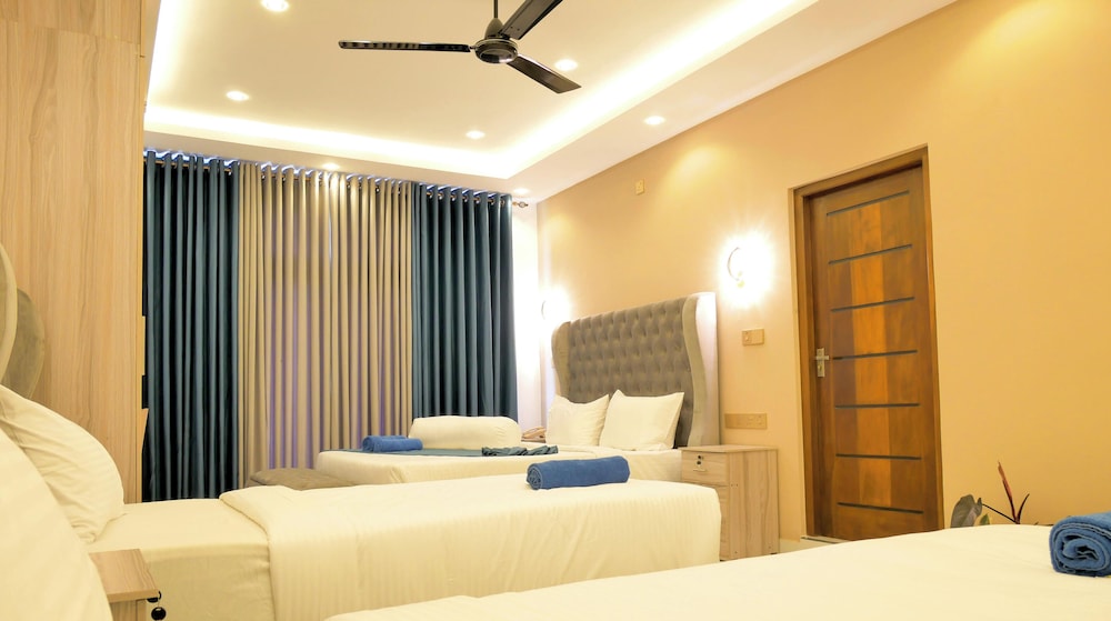 غرفة ملكية رباعية بسرير كينج، Nine Arch Holiday Resort 3/10