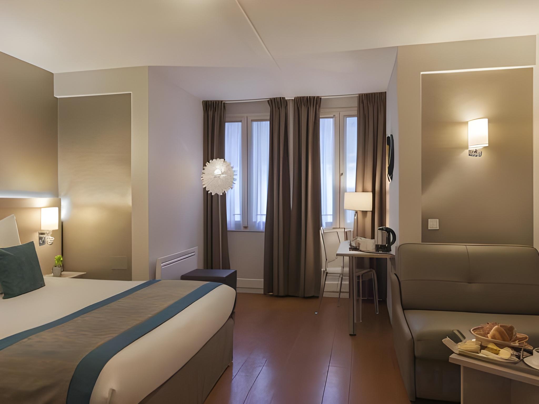 غرفة كومفورت بسرير مزدوج وسريرين منفصلين، Diese Hotel Bastille 3/3