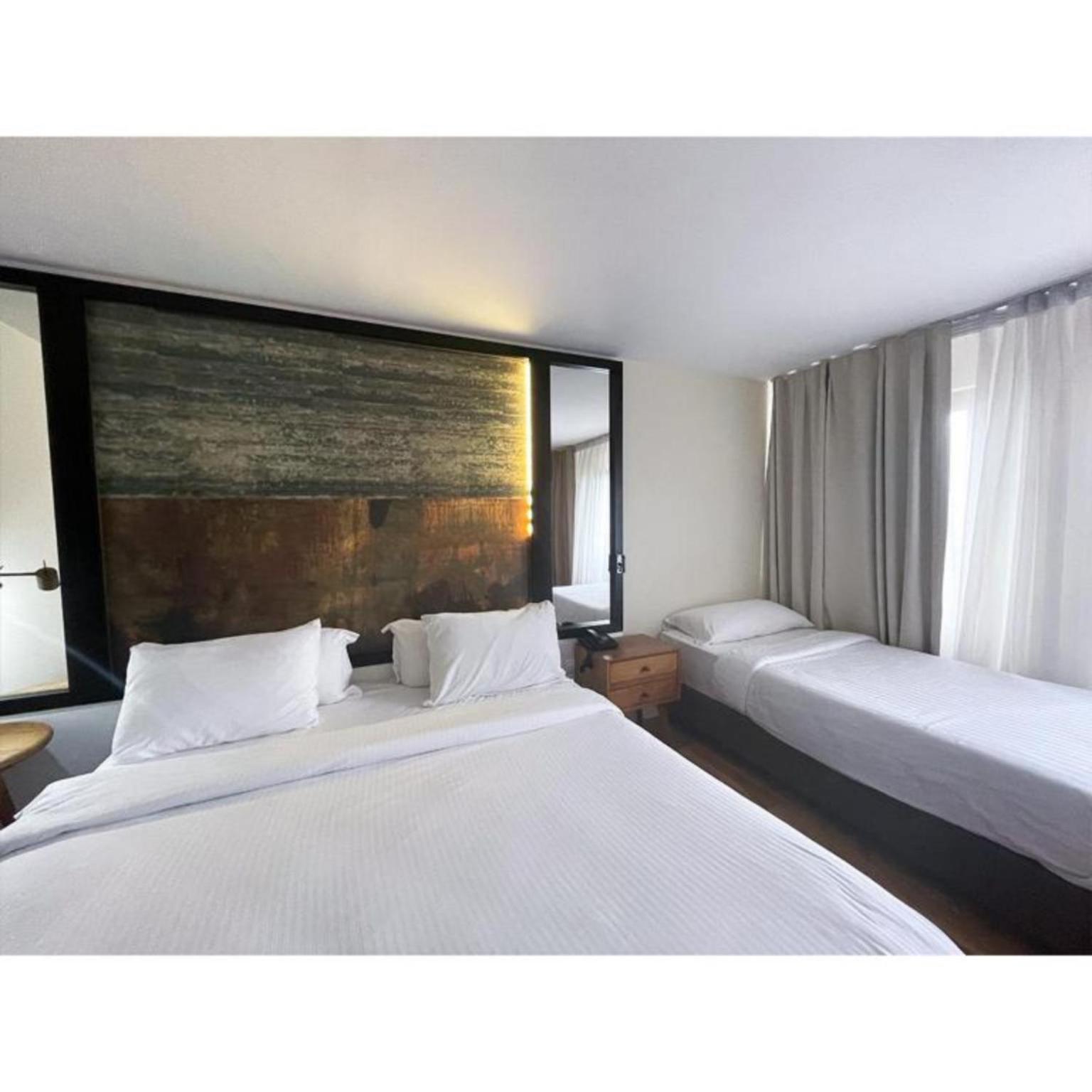 Deluxe, Triple, 1 Double and 1 Single Bed