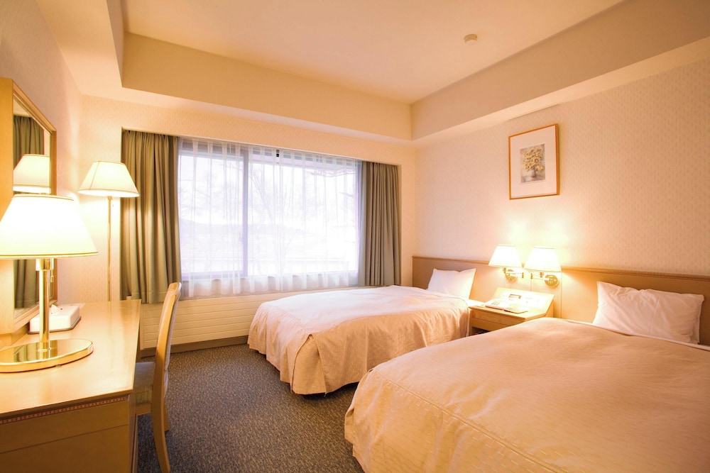 غرفة ديلوكس بسريرين منفصلين بمنطقة جلوس بمطبخ، Hotel Anbient Tateshina 2/4