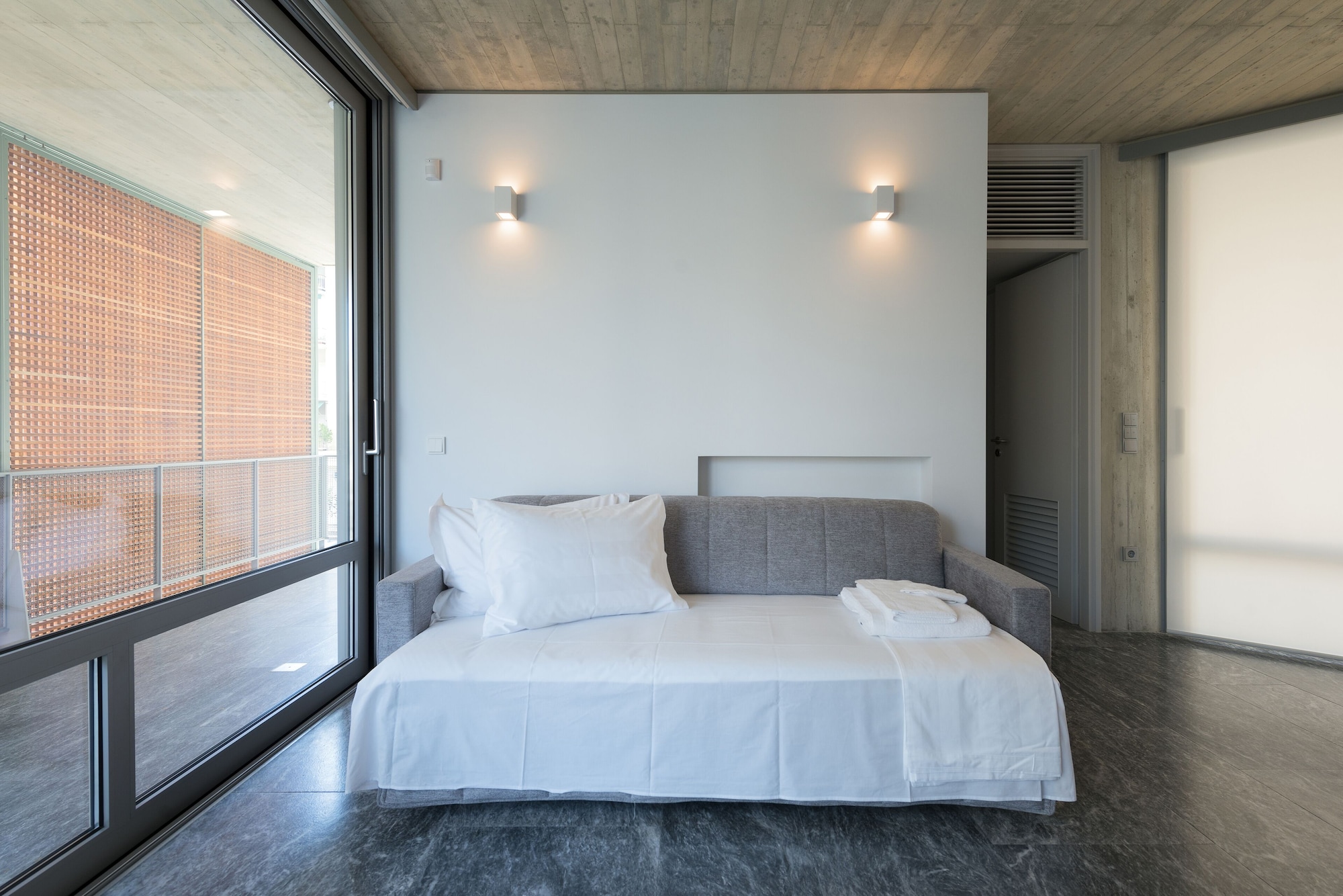 QUEEN BED, SOFA, BLUE BUILDING
