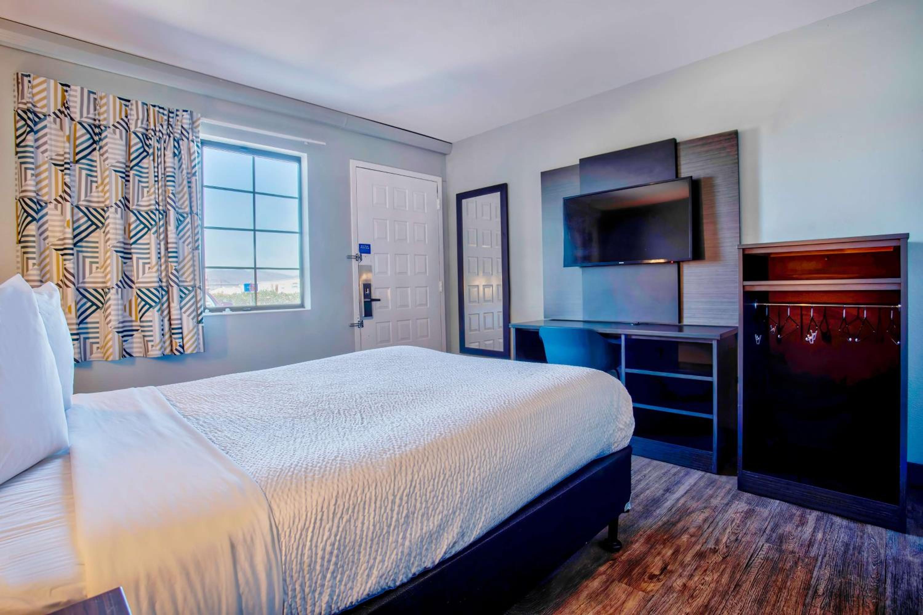 1 Queen Bed - Mini Fridge