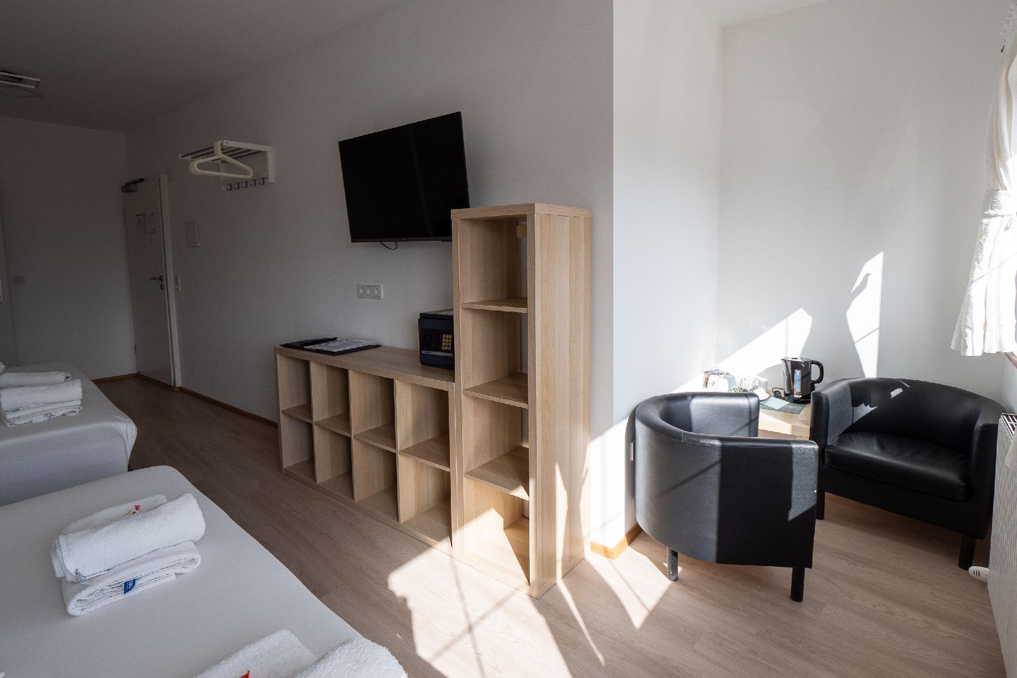 غرفة عائلية بسرير فردي وسريرين كوين، Hotel Heimgartl 3/3