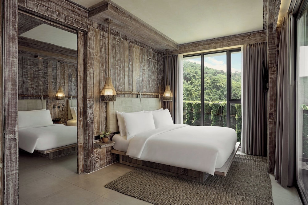 جناح ركني بسرير كينج وسريرين منفصلين بغرفتي نوم، Dinso Resort 7/7