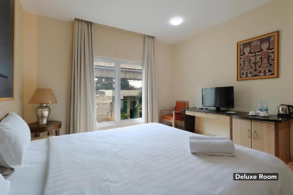 غرفة ديلوكس، Oyo 128 Mutiara Suites 2/6