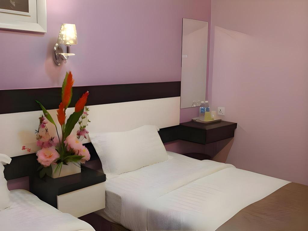 غرفة ثلاثية بسرير كوين وسرير فردي
