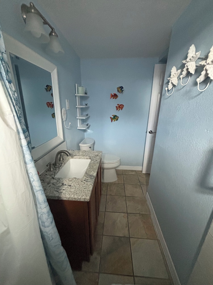 جناح ديلوكس بسرير كوين مع أريكة، Coco Sands Beachside Cottages 5/5