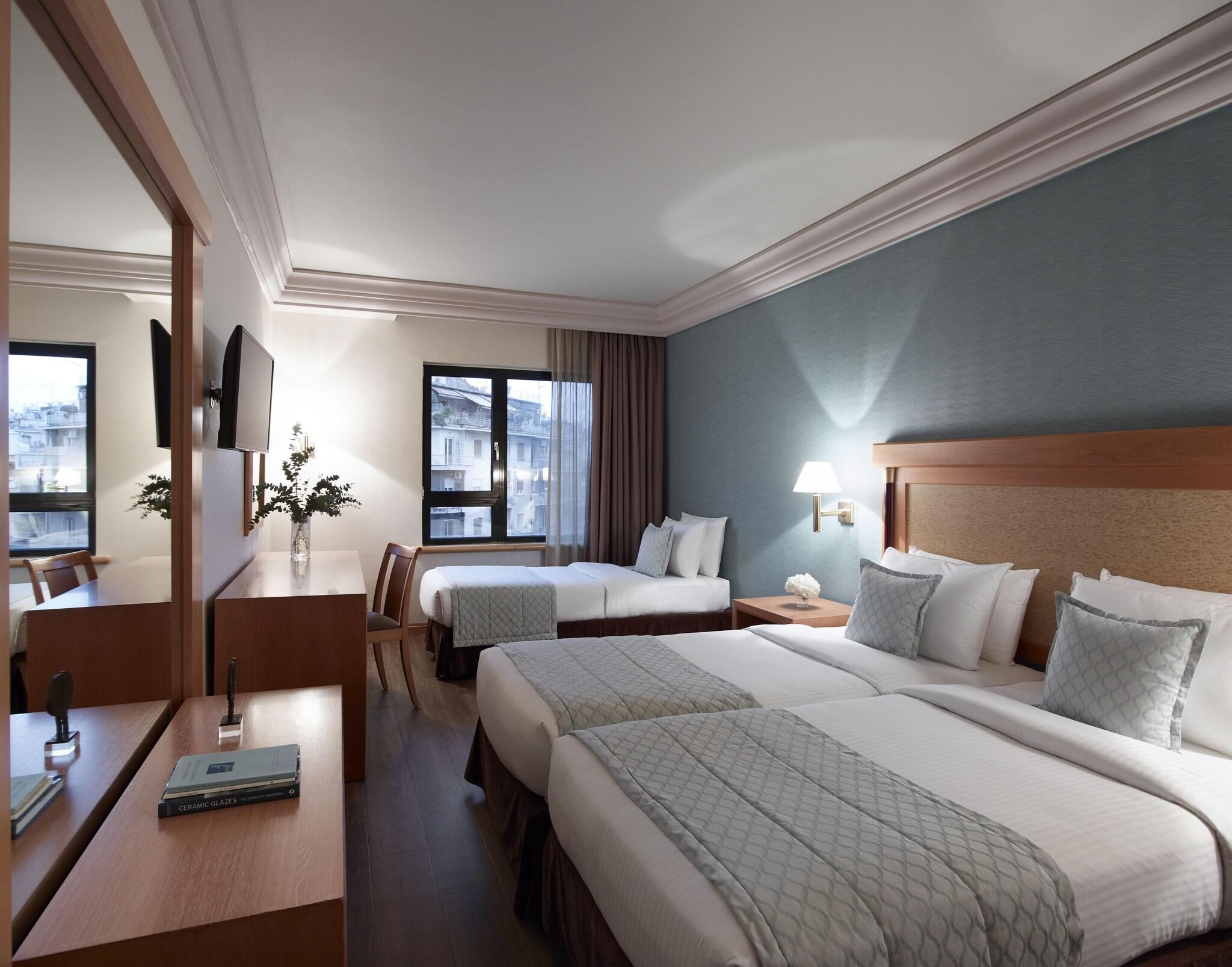 غرفة ثلاثية بسريرين