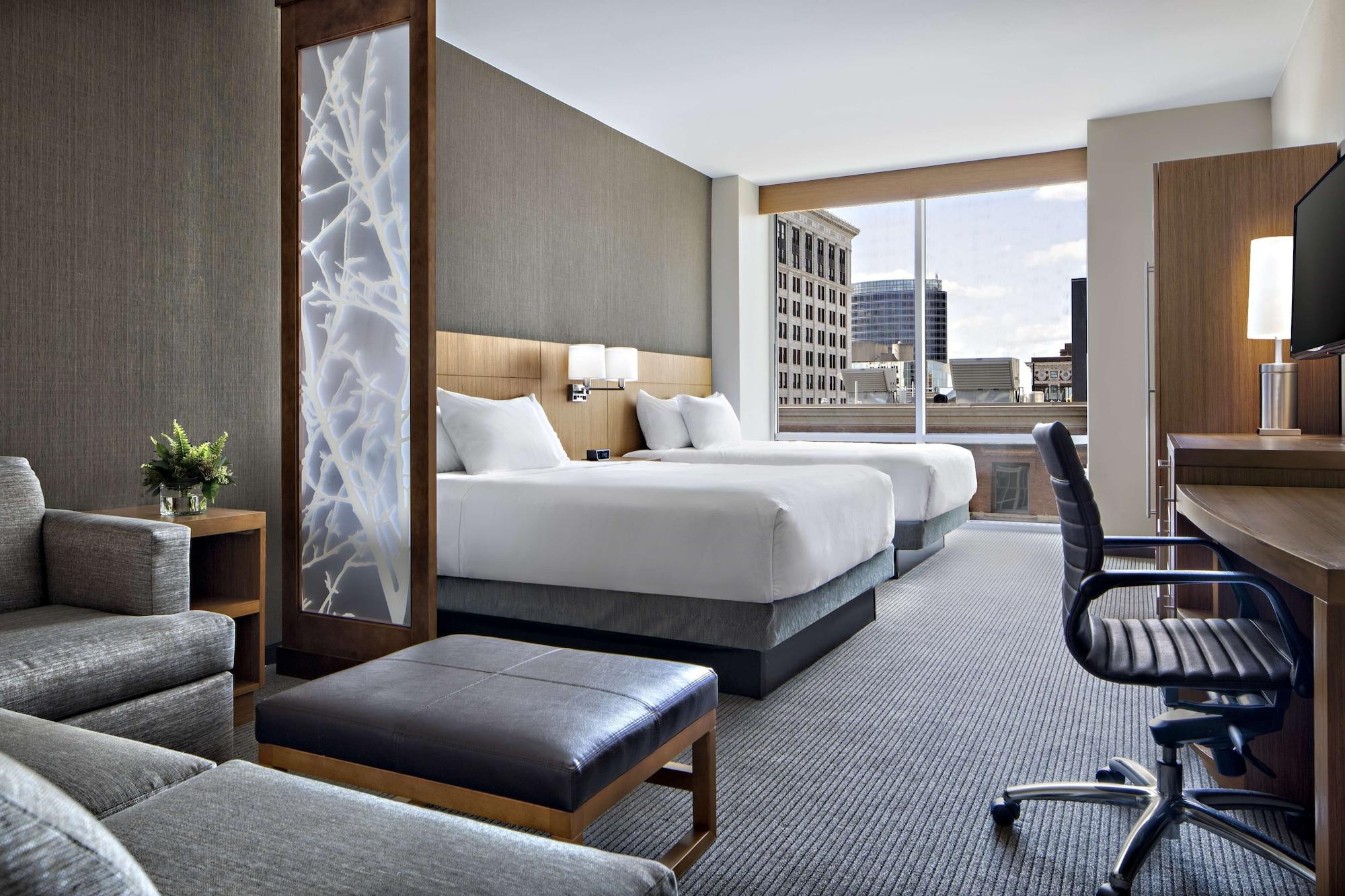 room, multiple beds, garden view