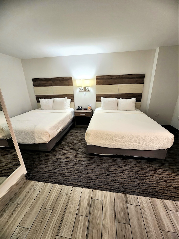 INTERIOR, 2 QUEEN BEDS, NO WINDOW, SOFA
