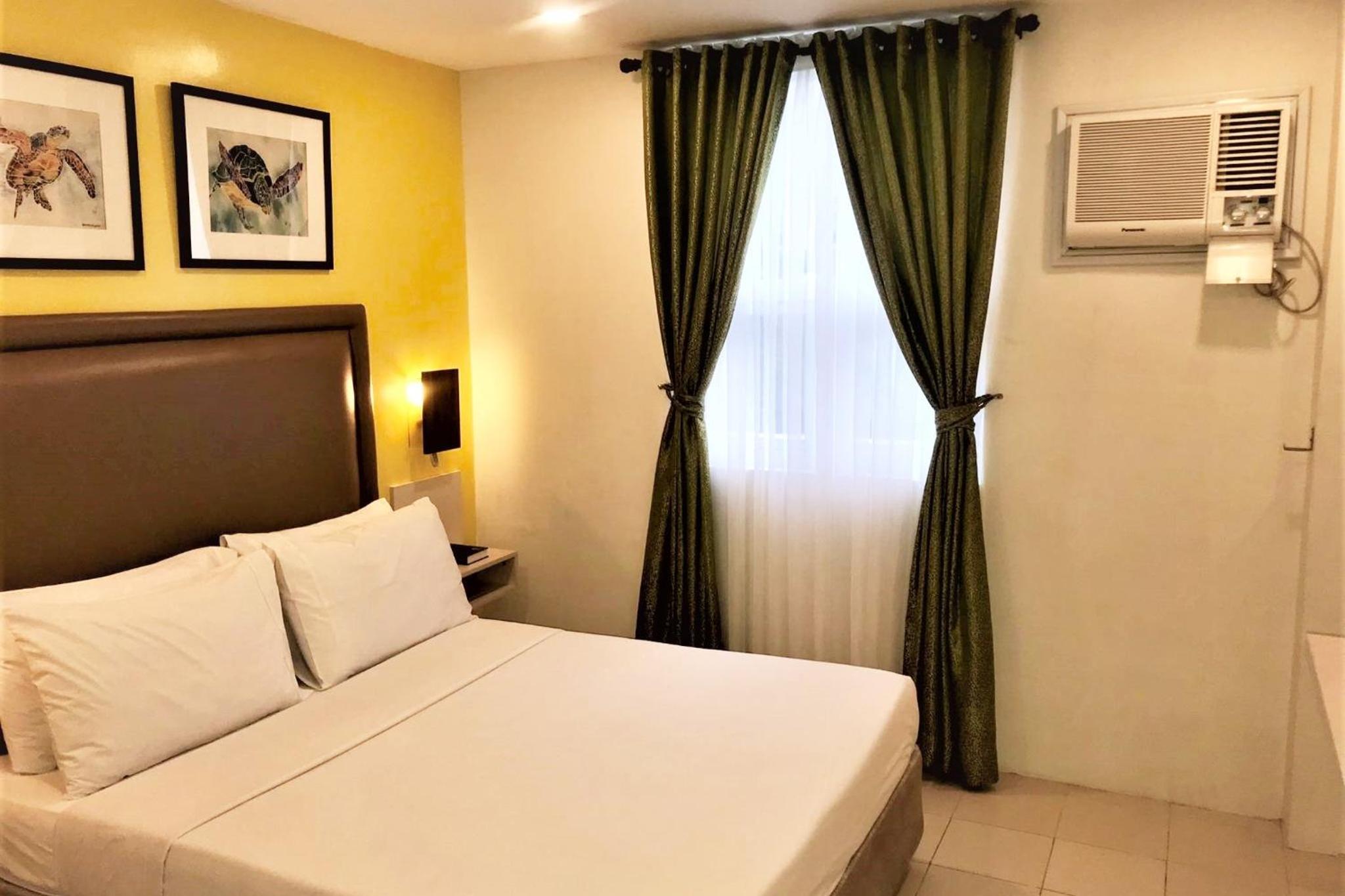 غرفة ديلوكس بسرير كينج وسرير كوين، Cebu Uncle Tom's Cabin Hotel 6/10