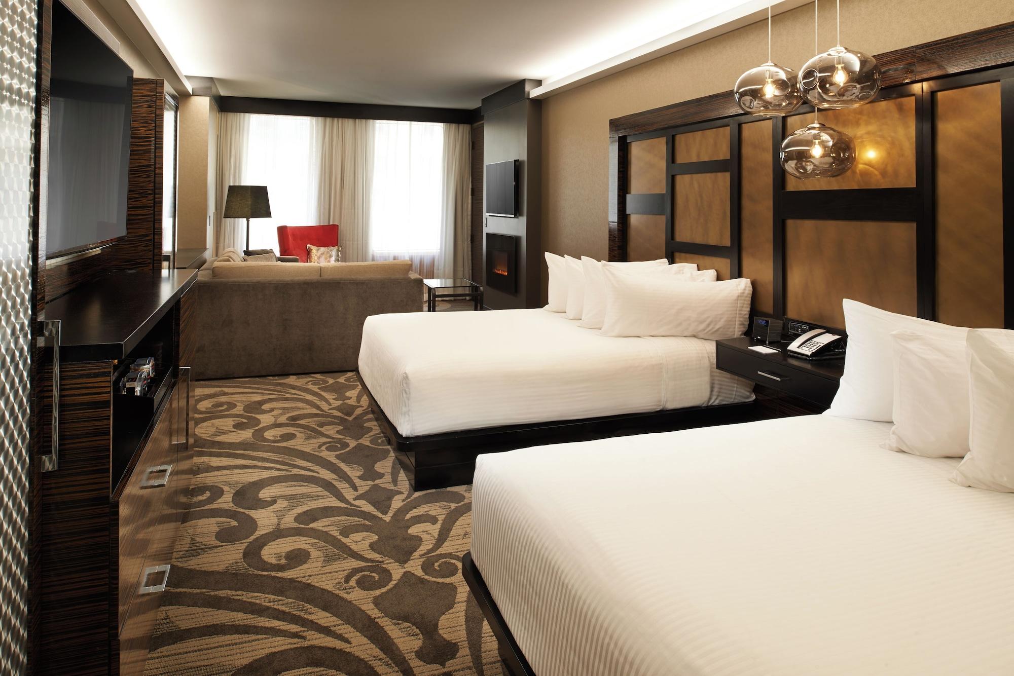 suite, multiple beds, city view