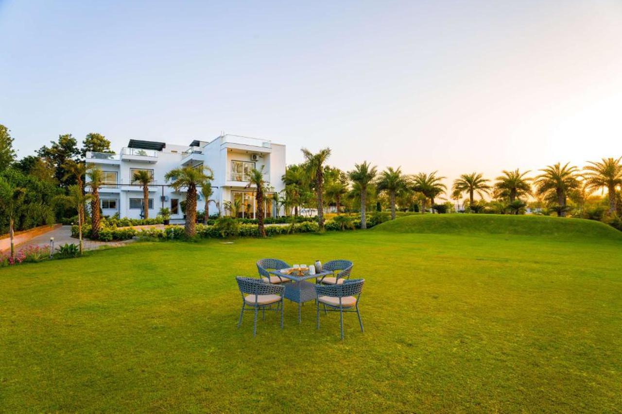 ELIVAAS AdhiVa Retreat 5 BHK Farmhouse with Pvt Pool, Bar & Lush Garden 11/15