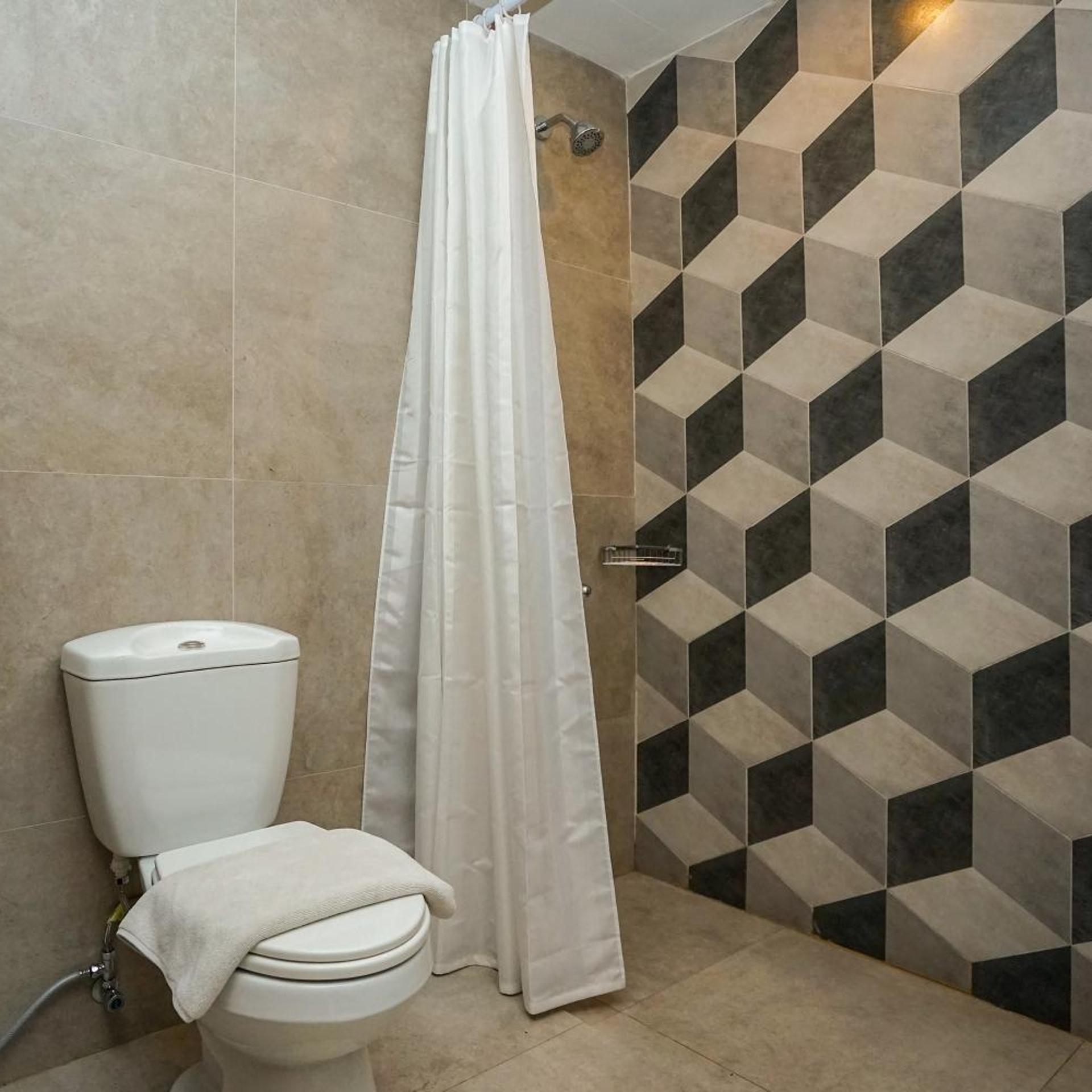 غرفة عائلية، Radja Art And Boutique Hotel Semarang 7/7