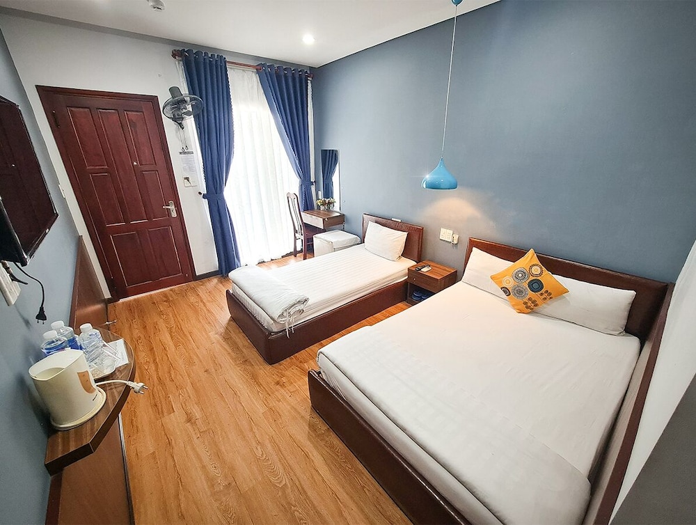 غرفة قياسية ثلاثية بسرير مزدوج وسرير فردي بإطلالة على الحديقة، QUAN QUAN HOTEL 5/8