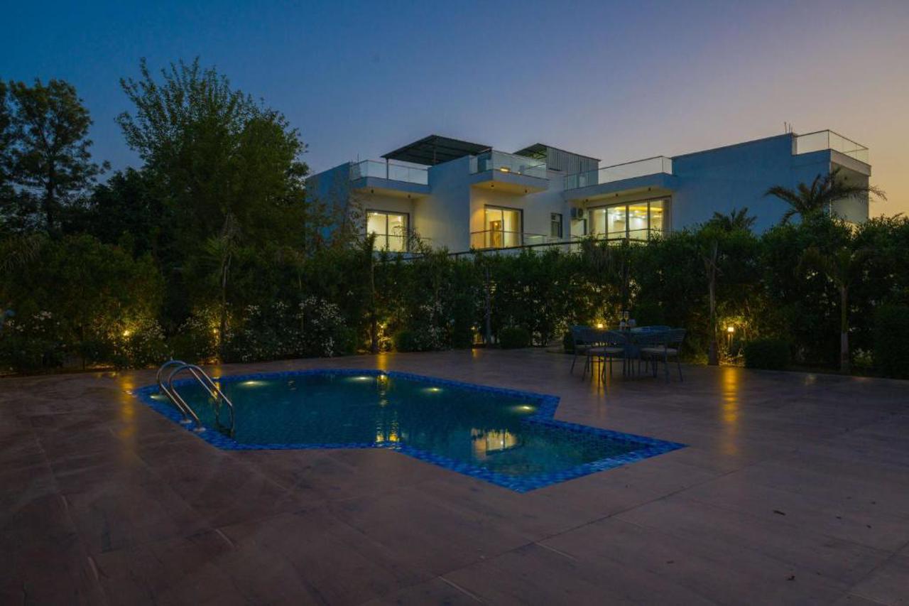 ELIVAAS AdhiVa Retreat 5 BHK Farmhouse with Pvt Pool, Bar & Lush Garden in GURGAON