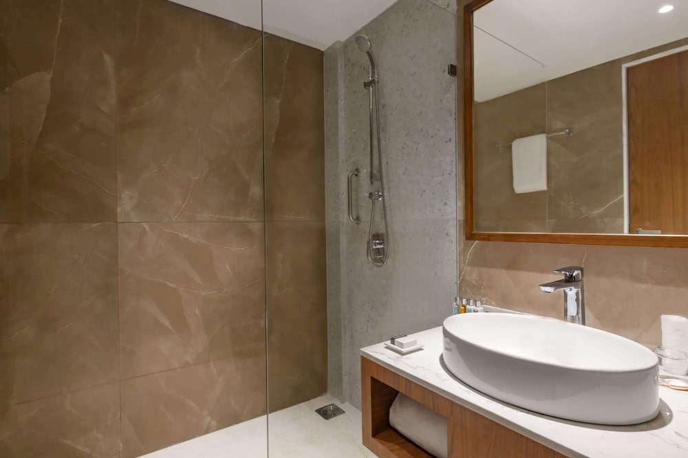 غرفة ديلوكس بسرير فردي، Hawthorn Suites by Wyndham Dwarka 4/4