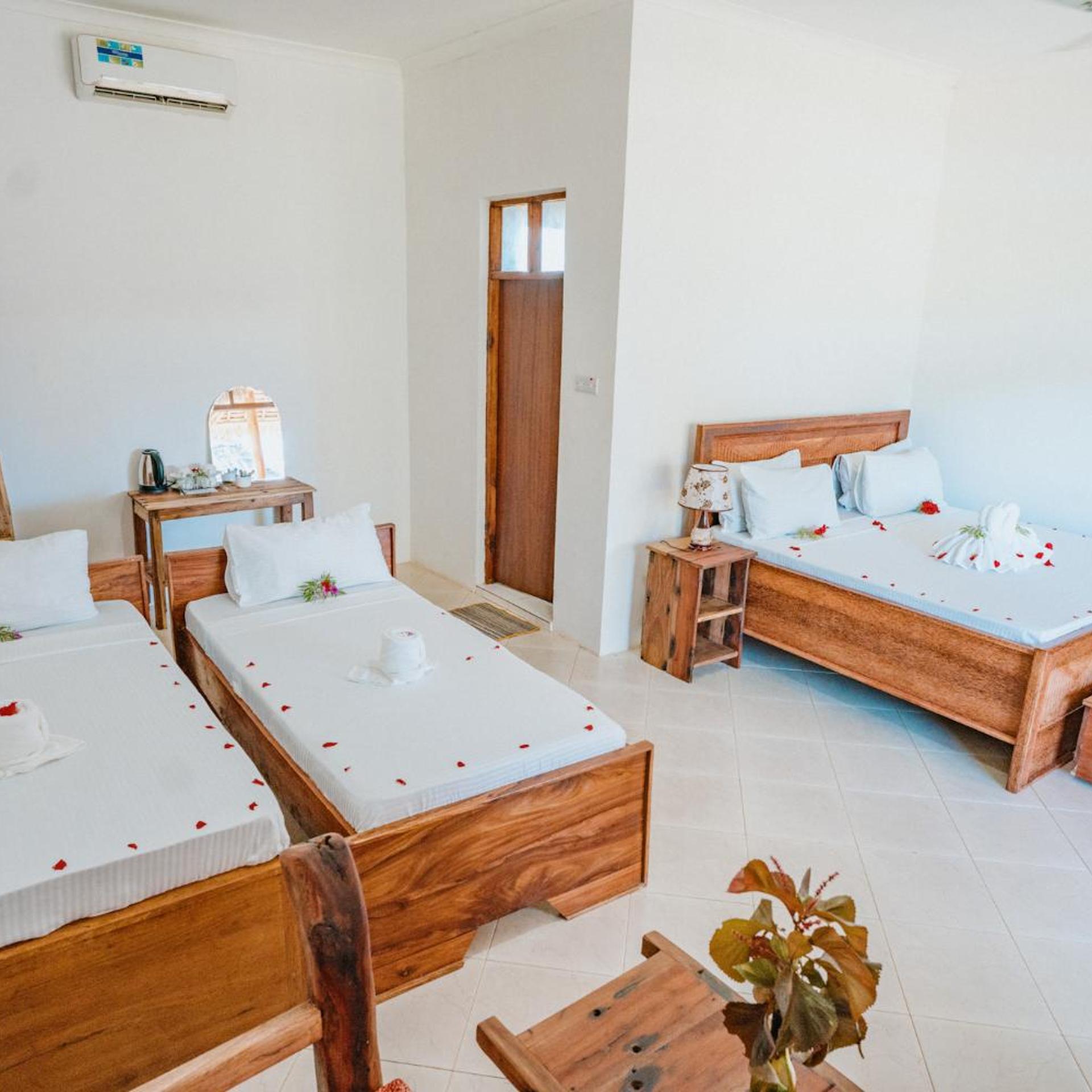 Triple Room Pool View, Bella Vista Resort Zanzibar 3/8