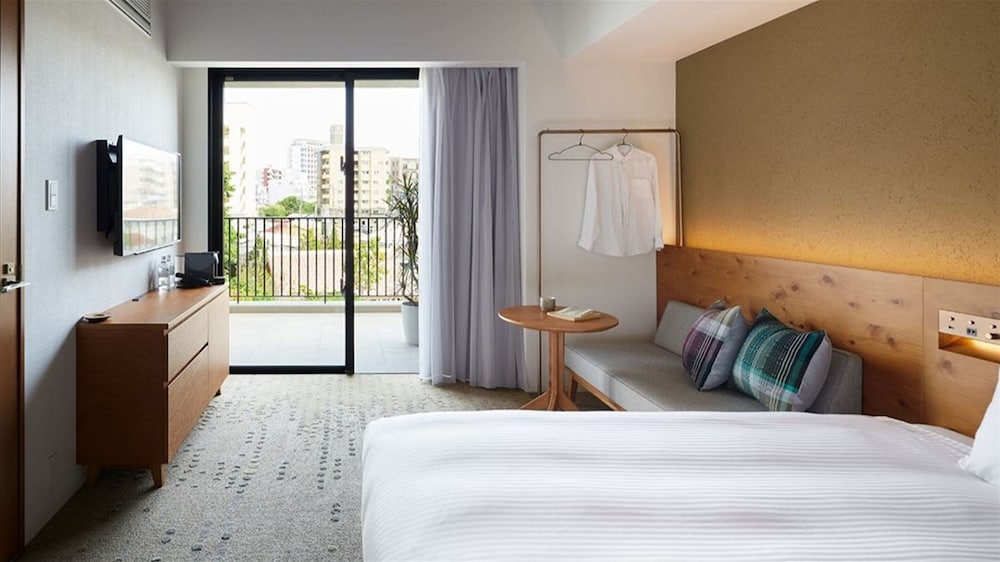 غرفة بسريرين منفصلين مع أريكة في طابق مرتفع، Hotel Strata Naha 3/7