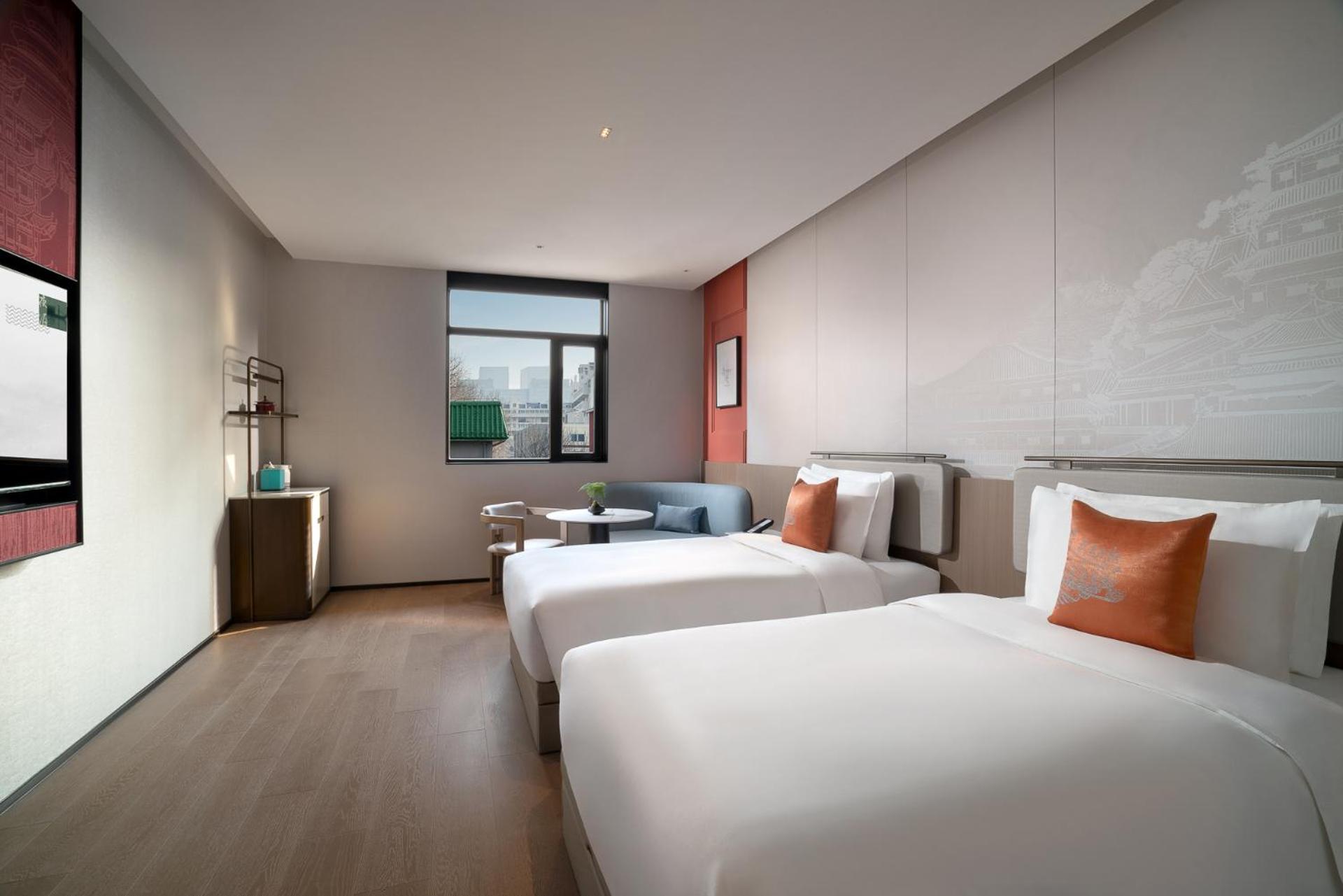 غرفة بسريرين منفصلين بإطلالة على الحديقة، SSAW Garden Hotel Beijing 2/6