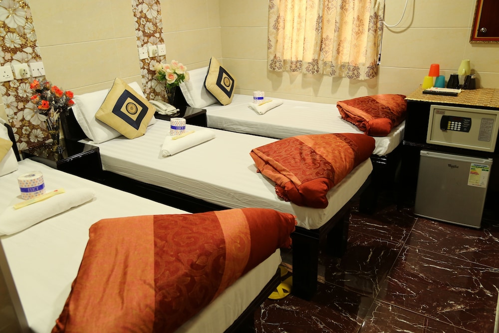 DELUXE, TRIPLE, 1 DOUBLE AND 1 SINGLE BED
