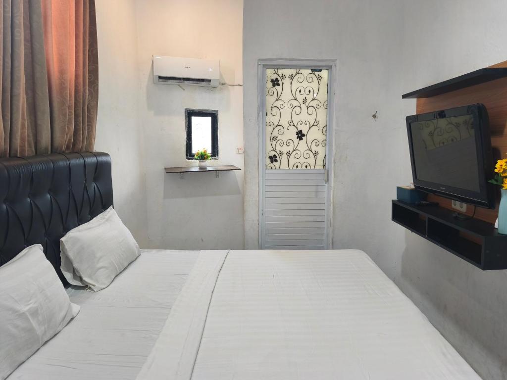 Room at Hotel O near Mall Boemi Kedaton formerly House Of Tuwuh 2, BANDAR LAMPUNG