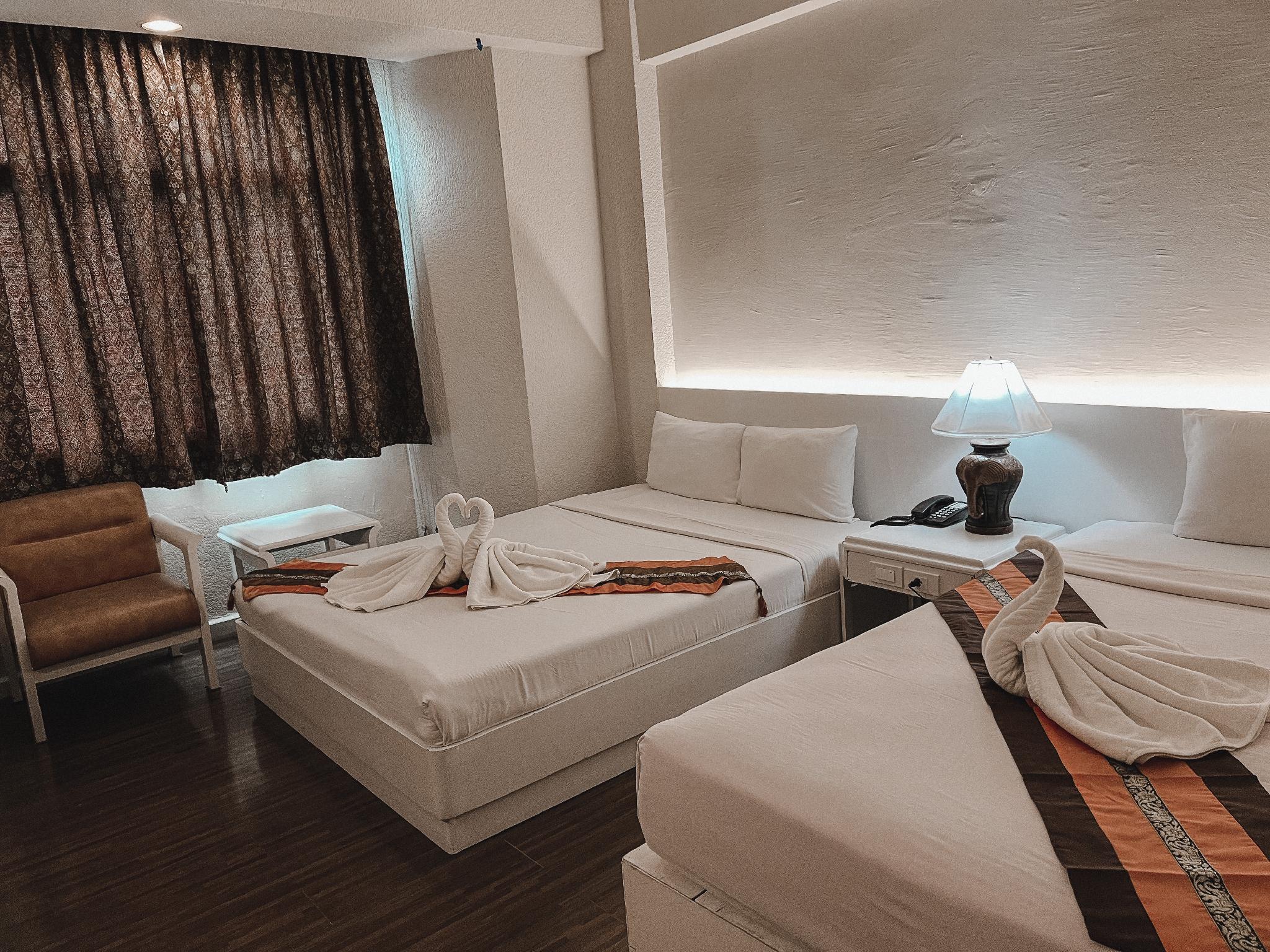 Deluxe, Triple, 1 Double and 1 Single Bed