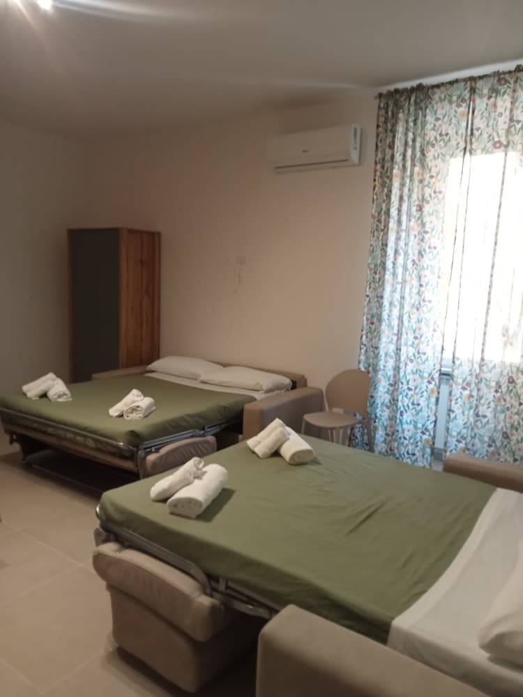 شقة سكنية فاخرة بأربعة أسرّة وسريرين كوين مع أريكة، Deluxe Rooms 7/9