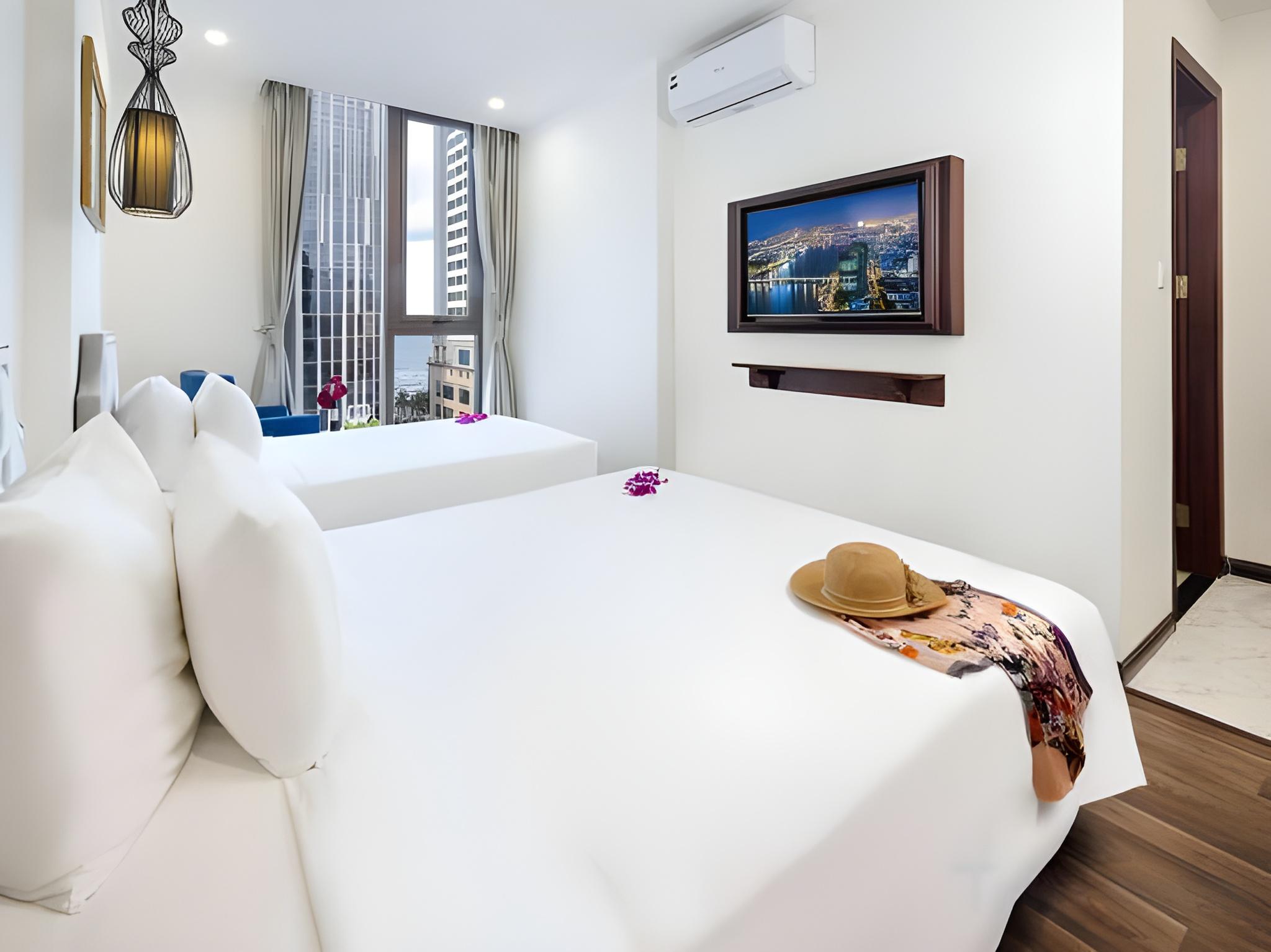 غرفة عائلية بسرير كوين وسرير فردي