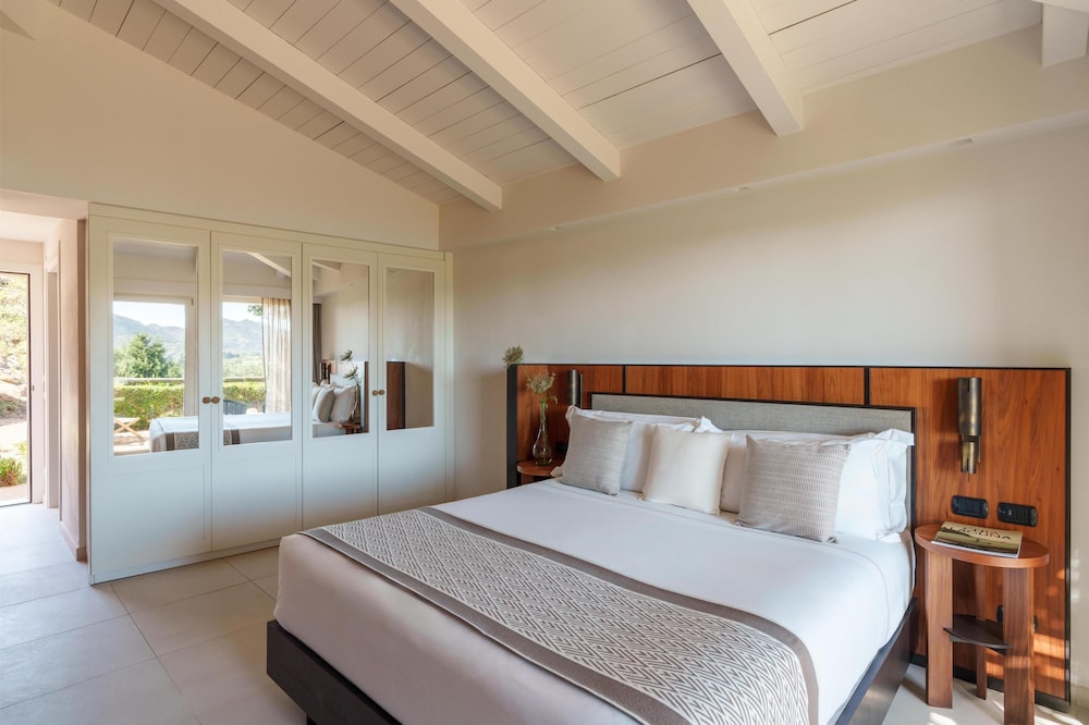 Room at Baia di Chia Resort Sardinia, Curio Collection by Hilton, DOMUS DE MARIA