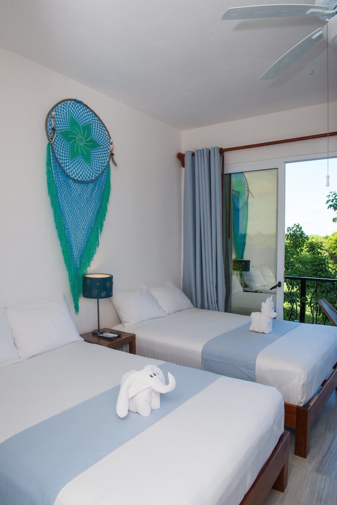 جناح فاخر اقتصادي تنفيذي بسريرين مزدوجين مع أريكة، Ocean Zen Suites 2/8