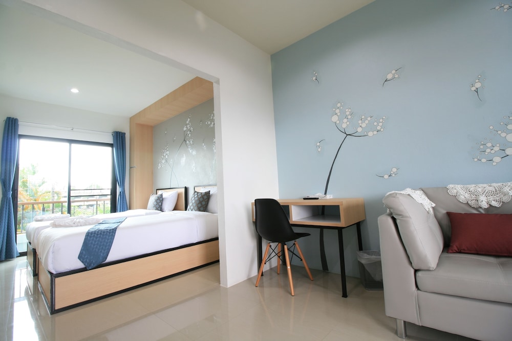 غرفة ديلوكس بسريرين منفصلين بشرفة، Sirimunta Hotel Chiang Rai Suite & Residence 5/8