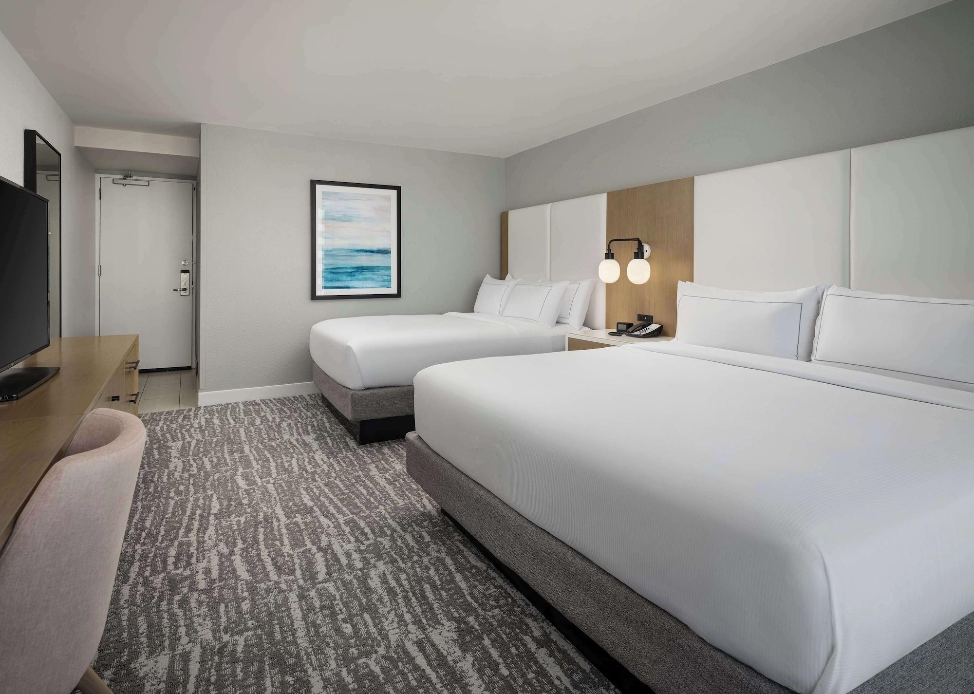 room, multiple beds, ocean view