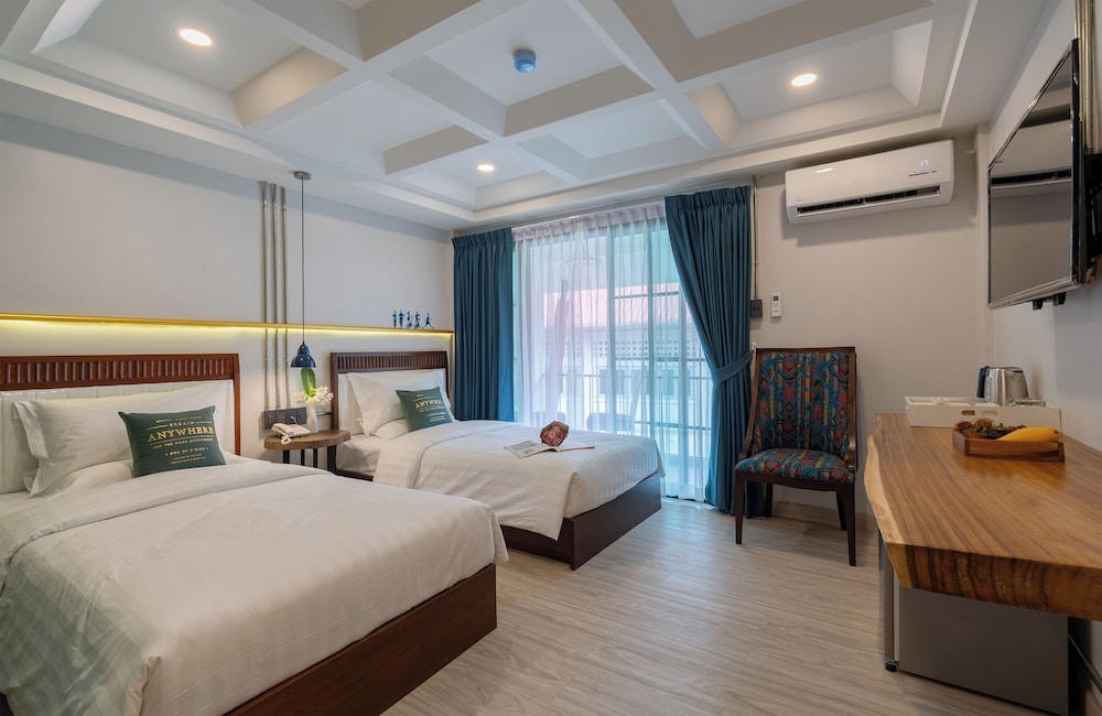 غرفة ديلوكس بسريرين منفصلين بإطلالة على المسبح بشرفة، Momo Hotel 2/4