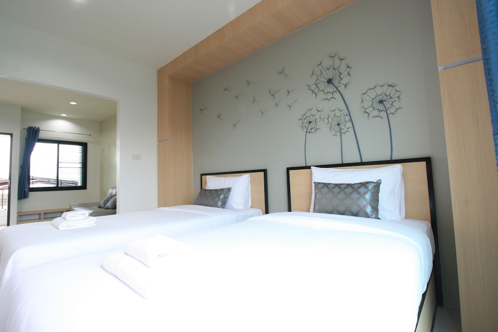 غرفة ديلوكس بسريرين منفصلين بشرفة، Sirimunta Hotel Chiang Rai Suite & Residence 4/8