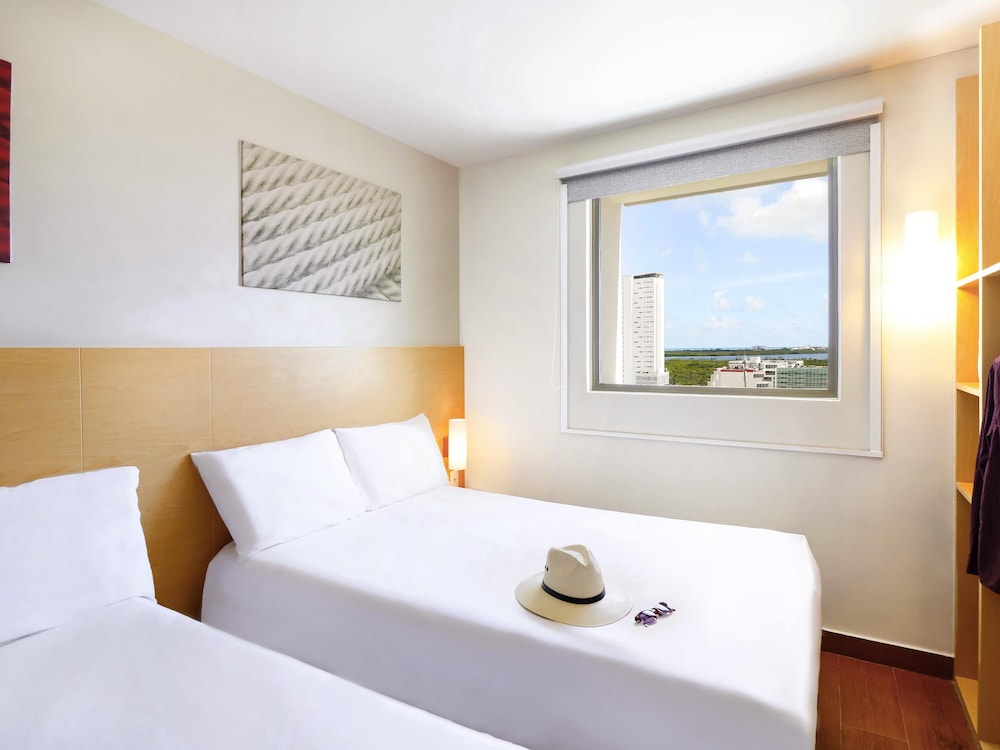A double bed overlooking the lagoon, safe, mini bar and double bed