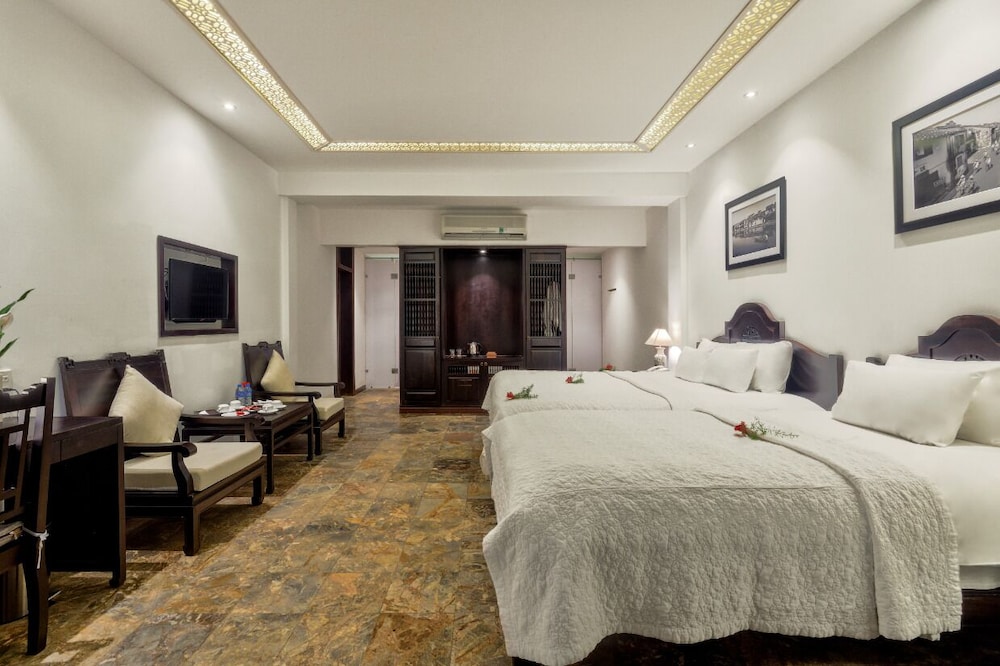 غرفة كلاسيكية ثلاثية بسرير كينج وسرير فردي بإطلالة على الحديقة، Hoi An Ancient House Resort And Spa 3/4