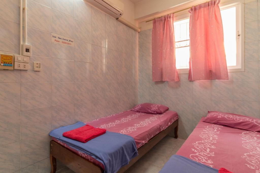 غرفة بسريرين منفصلين بحمام مشترك، New Central Guesthouse 4/6