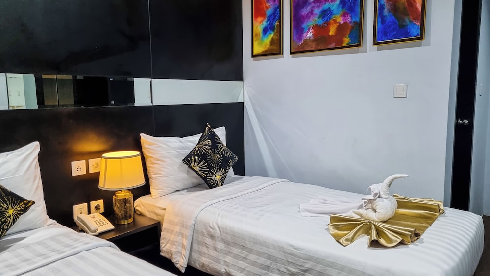 غرفة ديلوكس بسريرين منفصلين، Hotel Rasamala 3/4