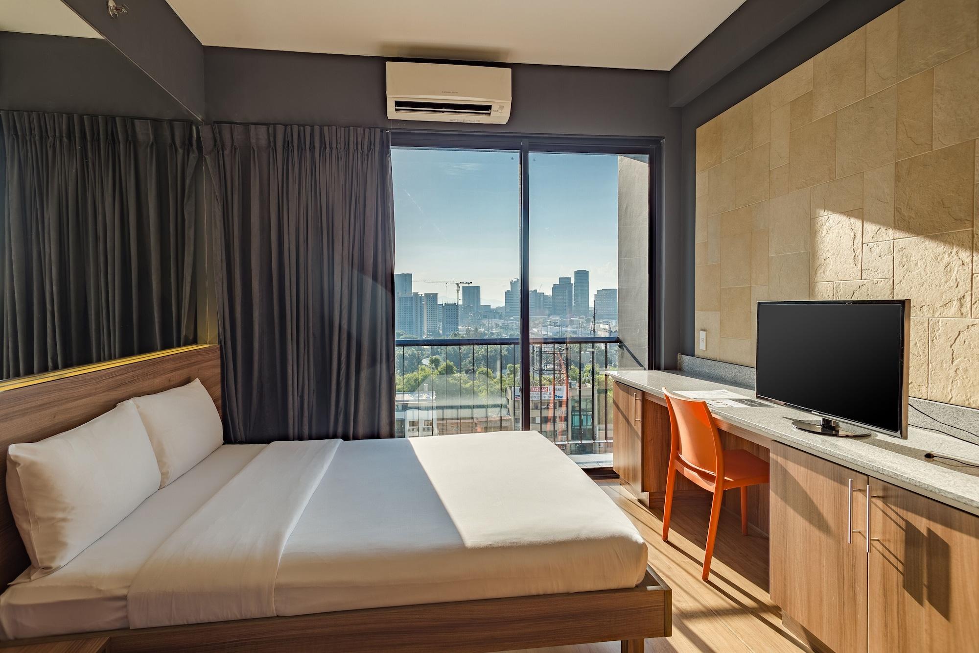 غرفة رباعية بسرير كوين، Azumi Boutique Hotel 7/9