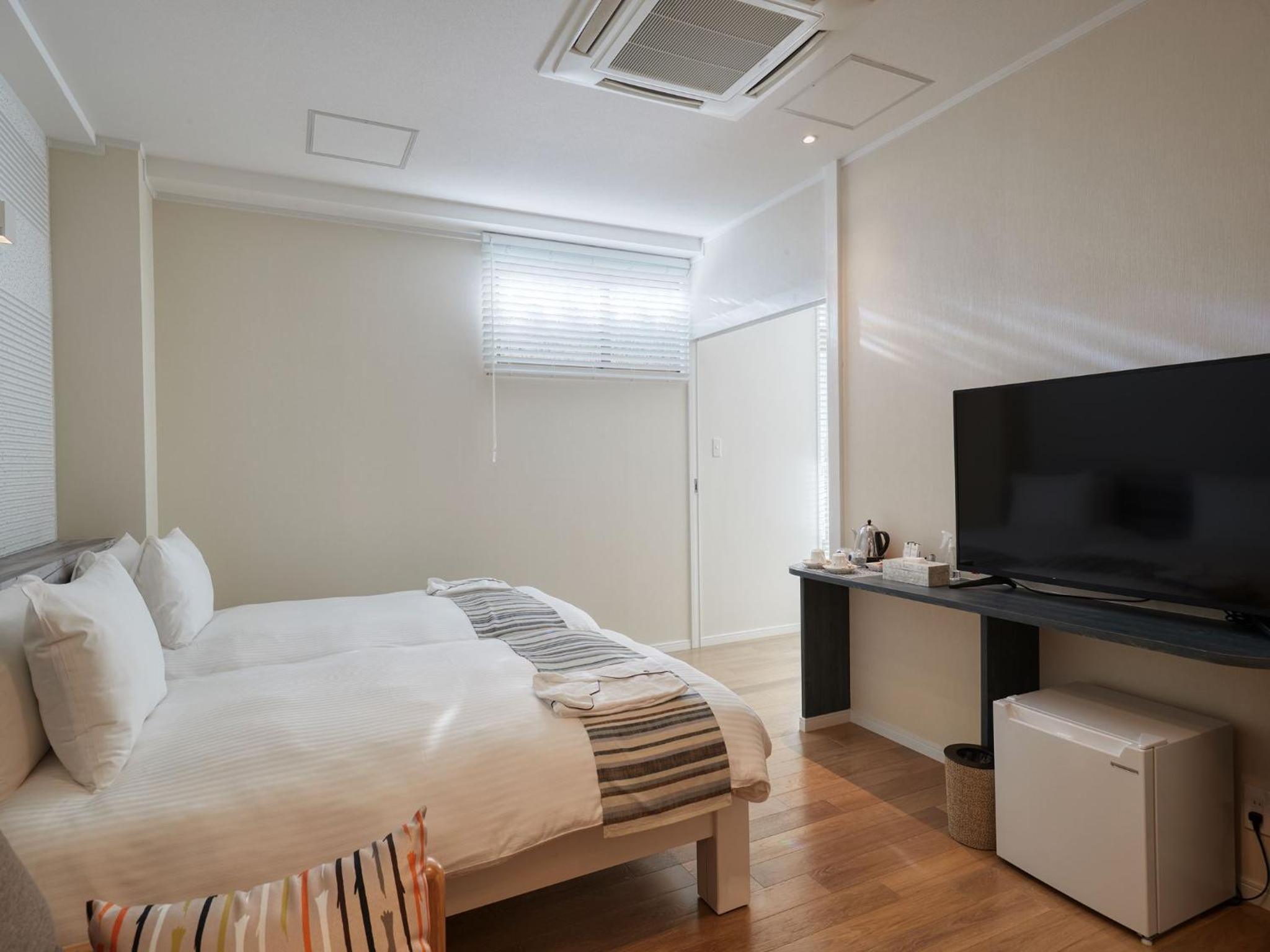 غرفة بسريرين منفصلين، La Casa Panacea Okinawa Resort 9/10