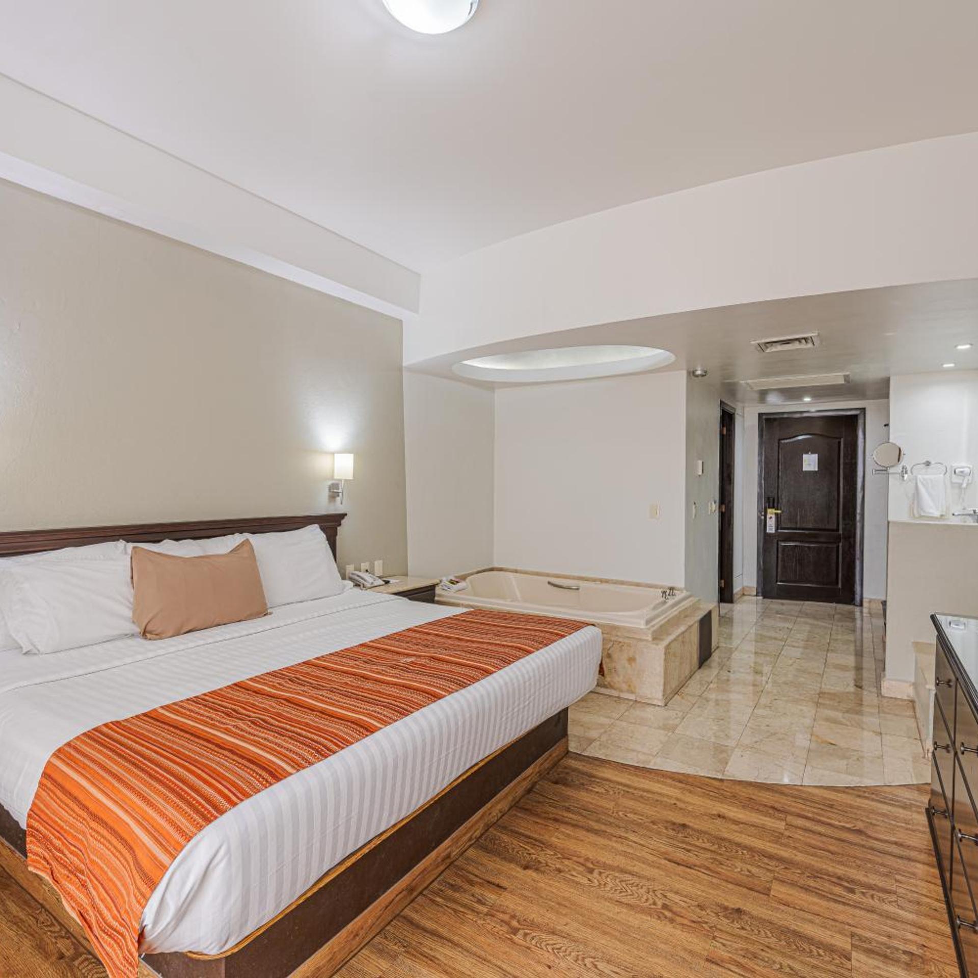 غرفة بسرير كوين بجاكوزي، HG HOTEL 3/10
