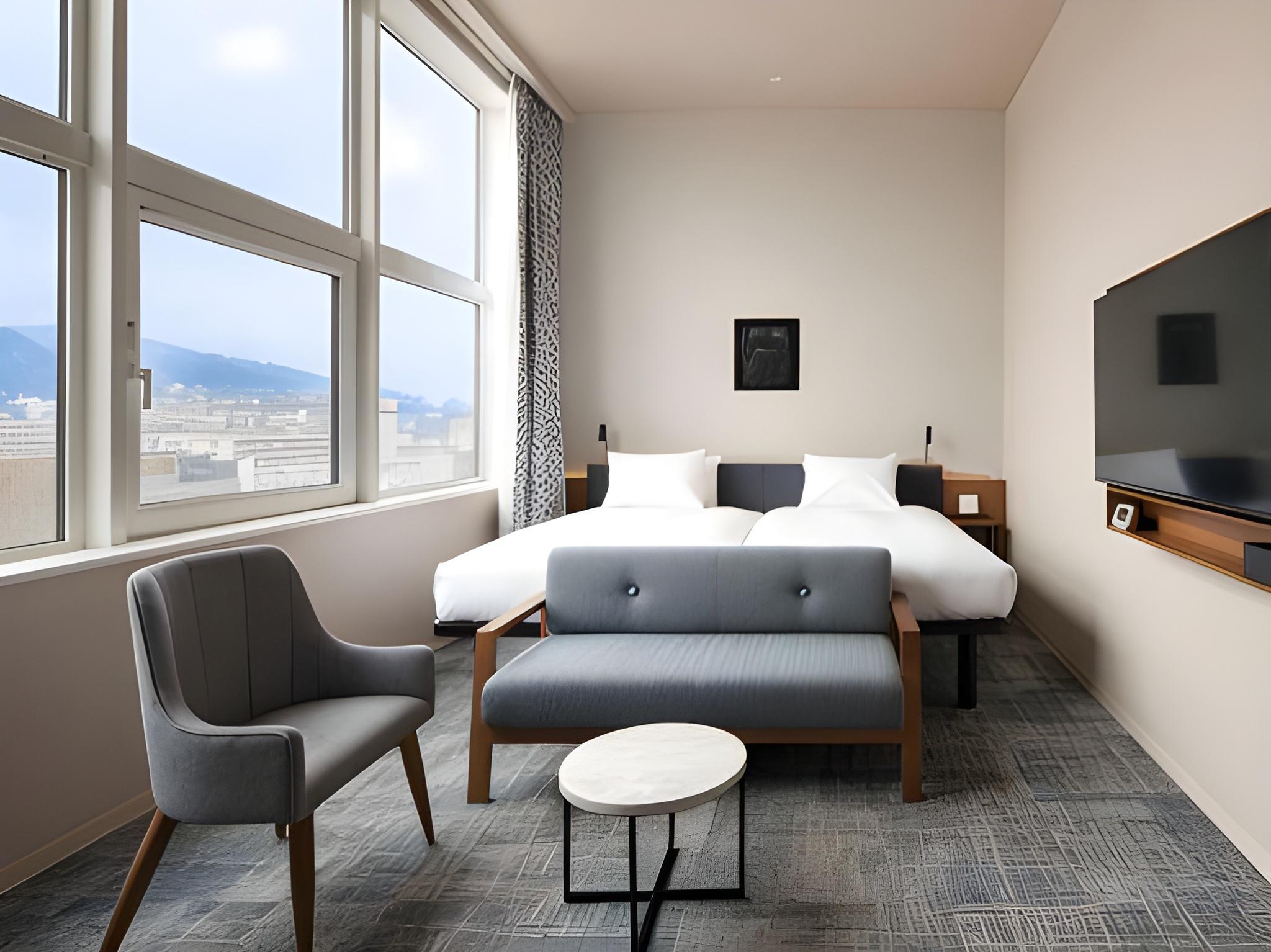 غرفة بريميوم عائلية بسريرين منفصلين وفرشتي فوتون