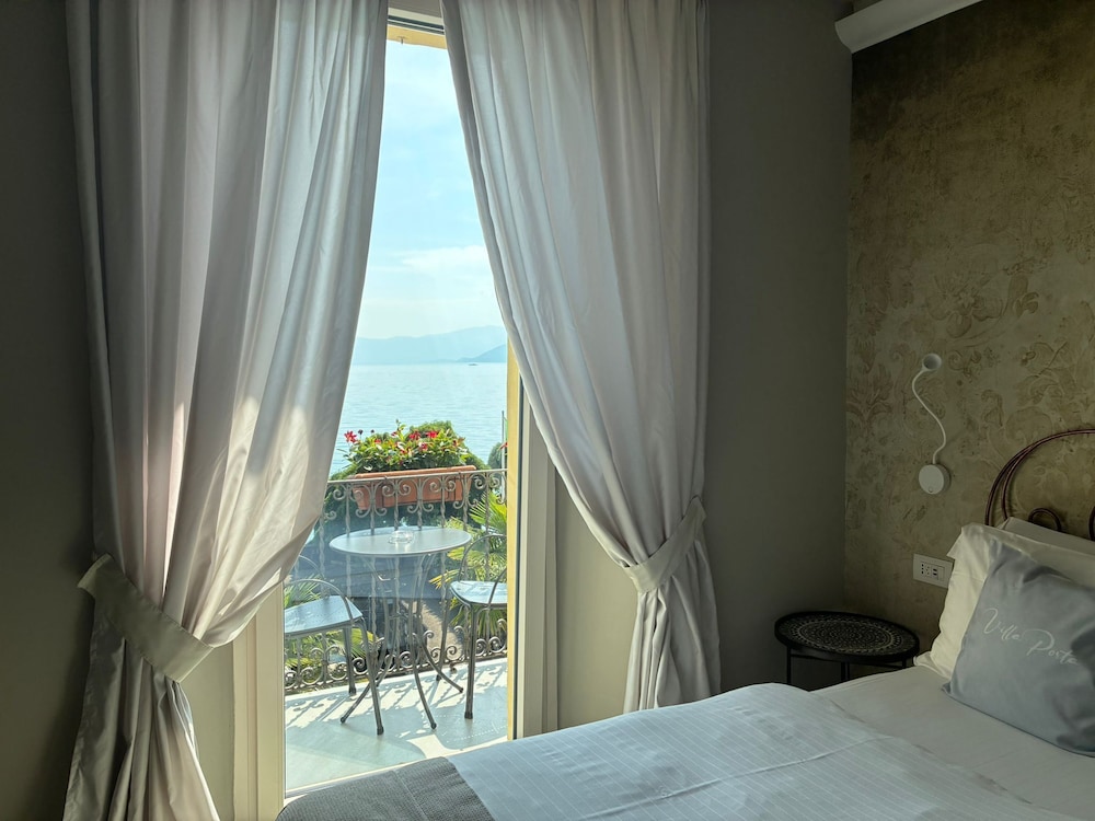 جناح عائلي ديلوكس بفراش فوتون وسريرين منفصلين وسرير مزدوج وسرير فردي بشرفة، Relais Villa Porta 2/4