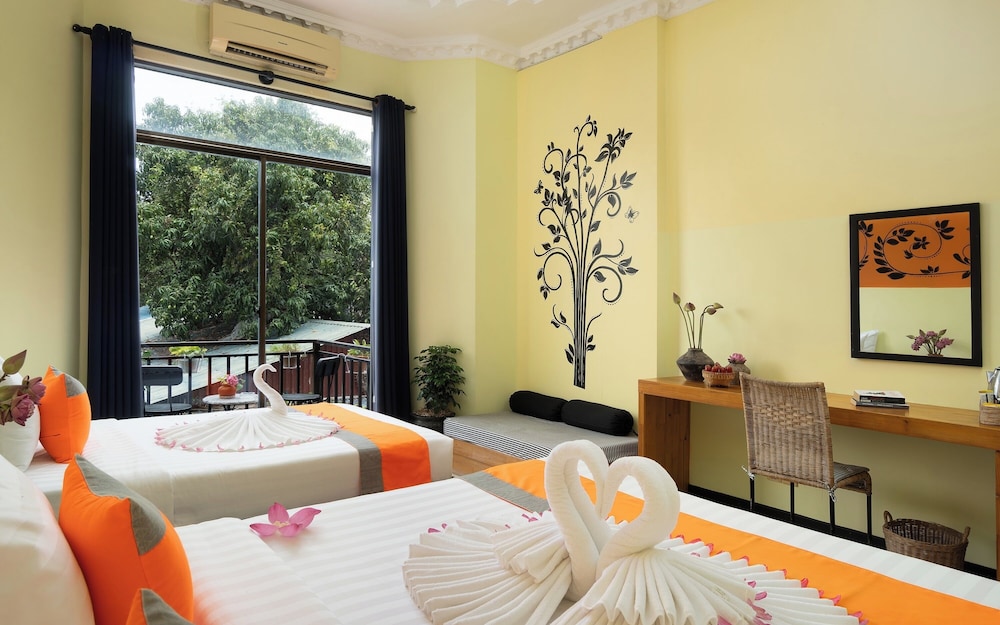 غرفة ديلوكس عائلية بسرير كينج وسرير فردي بشرفة، Central Indochine D Angkor Hotel 6/10