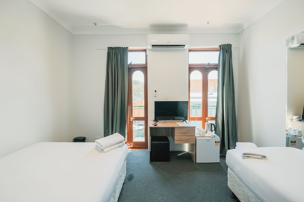 غرفة بسريرين منفصلين بحمام مشترك، Newtown Cozystays 4/8