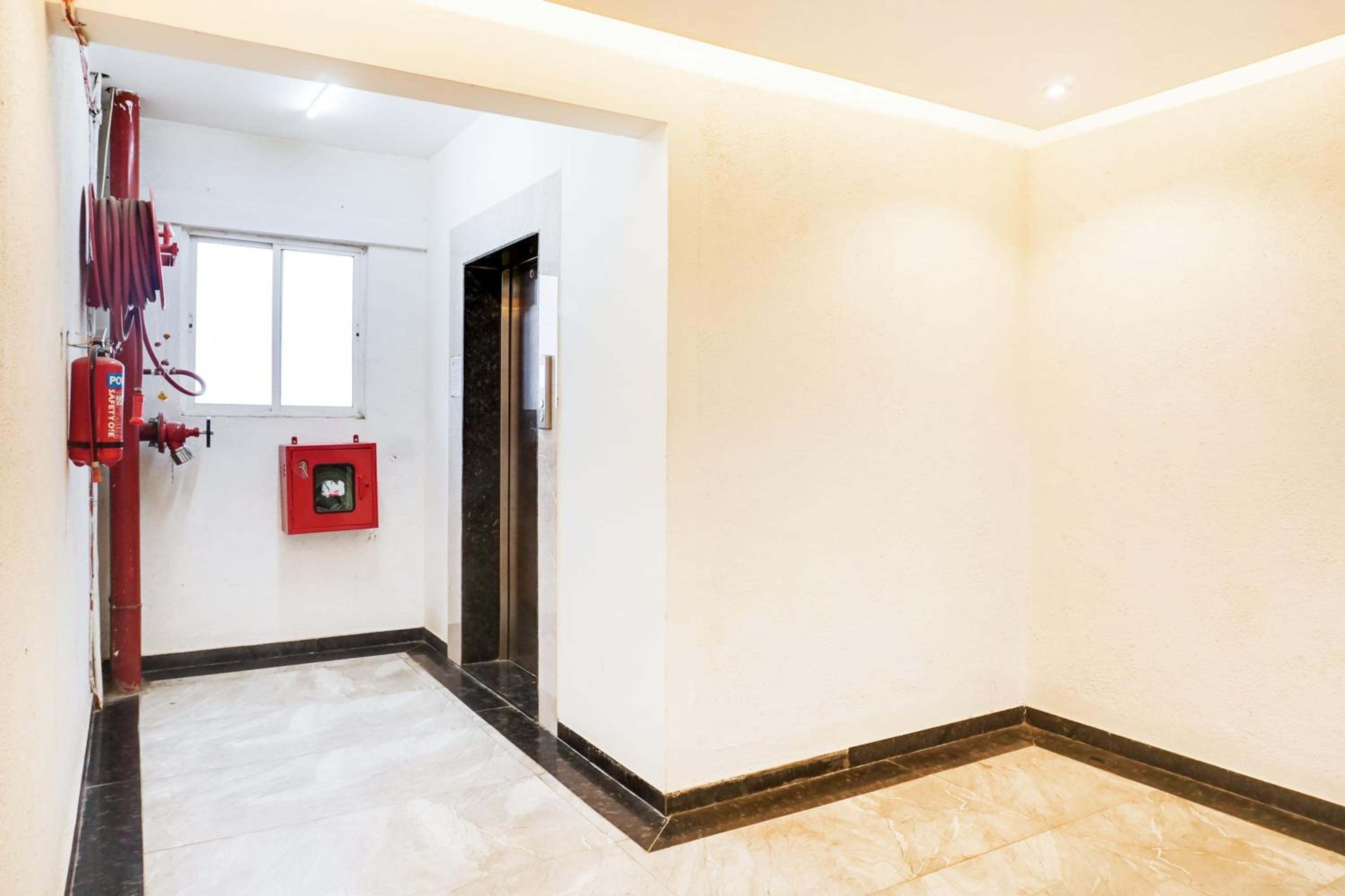 Super Townhouse Lohegaon Near Pune Airport formerly Landmark Regency 25/29