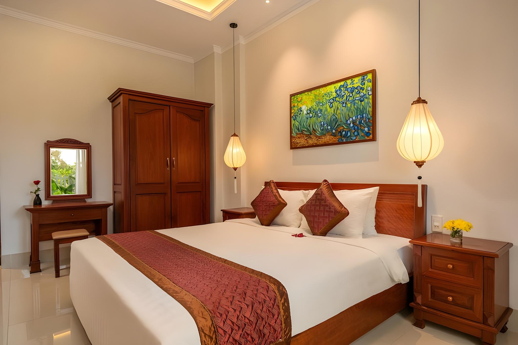غرفة ديلوكس بسرير كينج بإطلالة على الحديقة، Iris Villa Hoi an 2/2