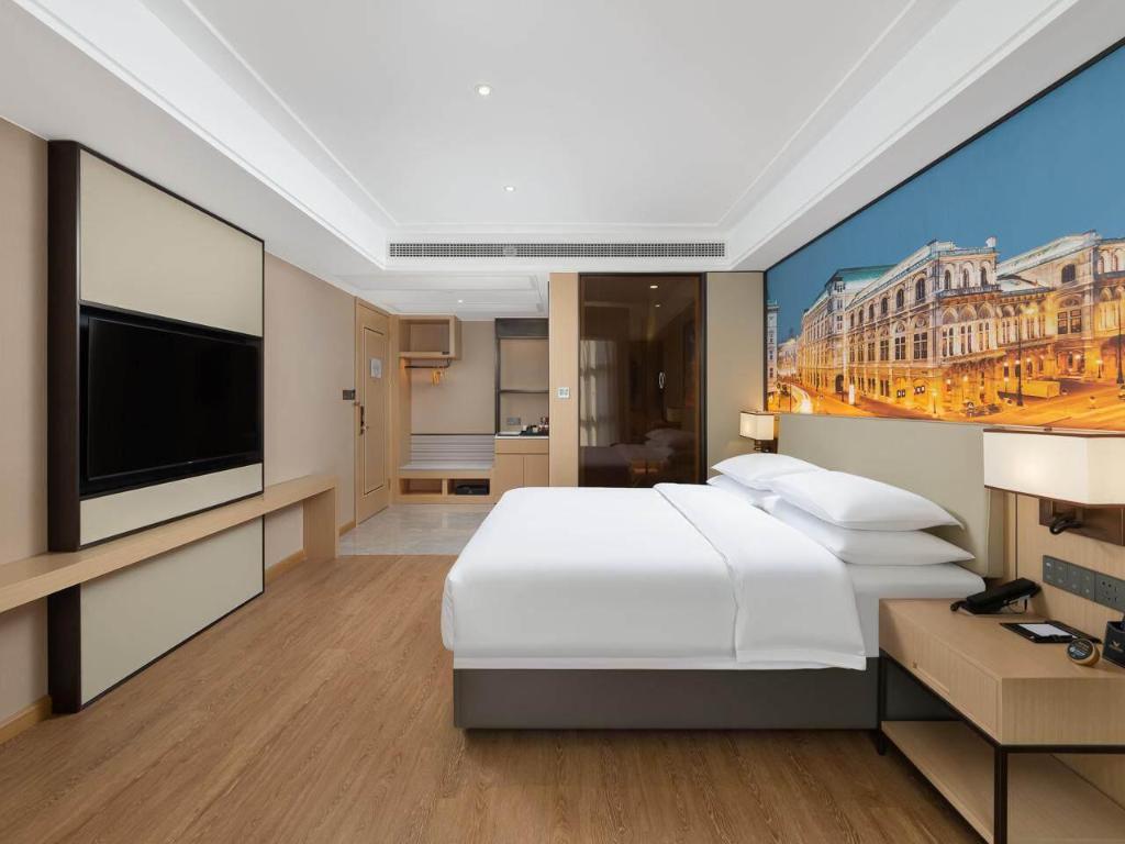 غرفة تنفيذية بسرير كوين، Vienna International Hotel (Chongqing Liangjiang New District Longxing Branch) 3/3